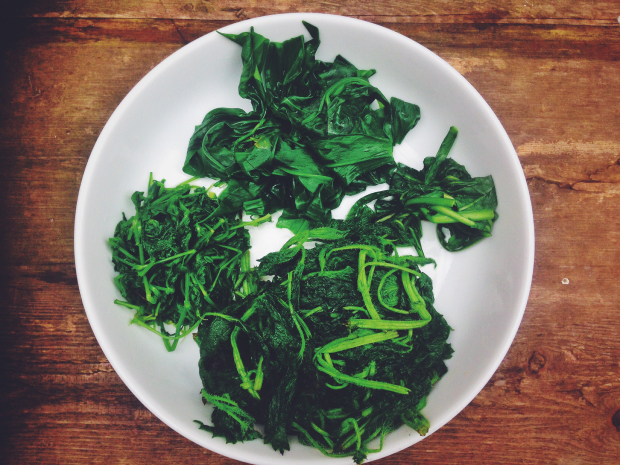 blanched wild greens in a bowl